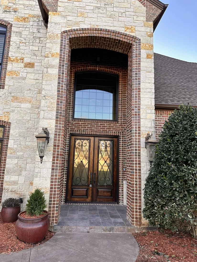 Custom arched entry door installed by Going Green Concepts
