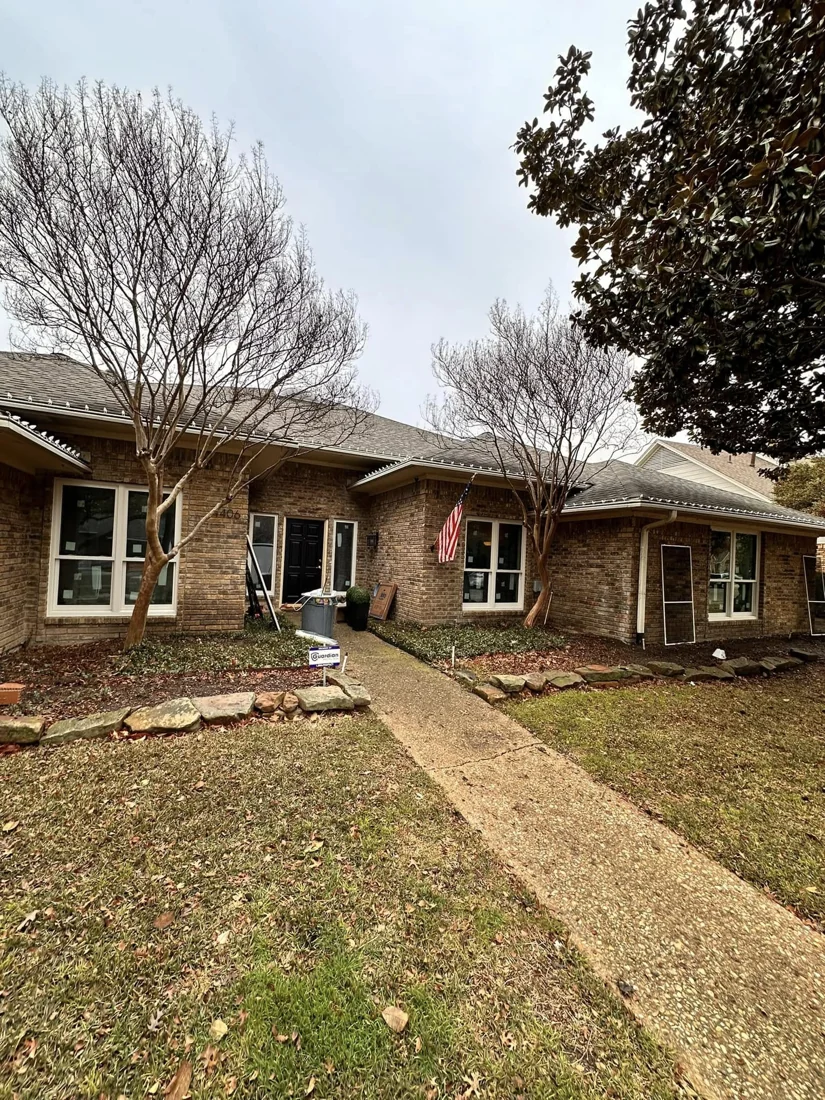 Completed window replacement on a single-story brick home